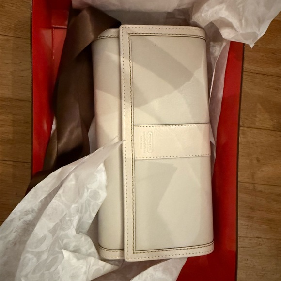 Coach Handbags - Coach Ivory Leather Clutch